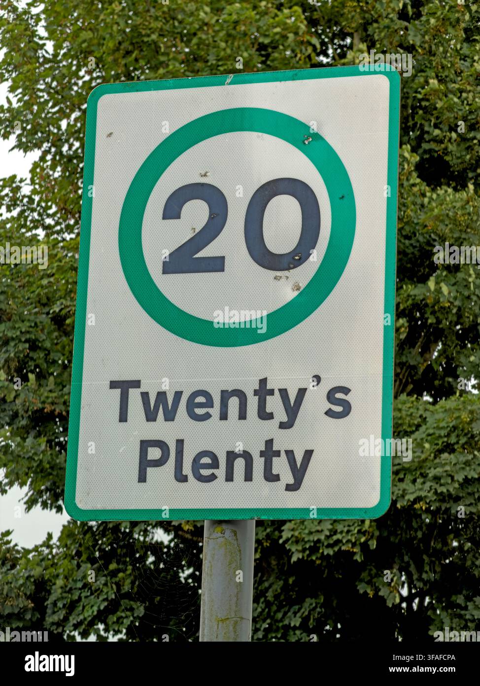 Green 'Twenty's Plenty' 20 mph road sign near Stonehouse, South Lanarkshire, promoting lower speeds and safer local streets. Stock Photo