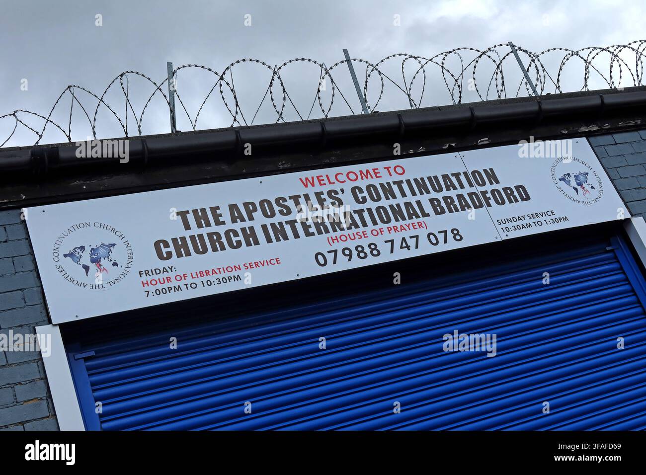 Apostolic Continuation Church International Brotherhood banner on a secure industrial unit in Bradford, West Yorkshire, England, UK. Stock Photo