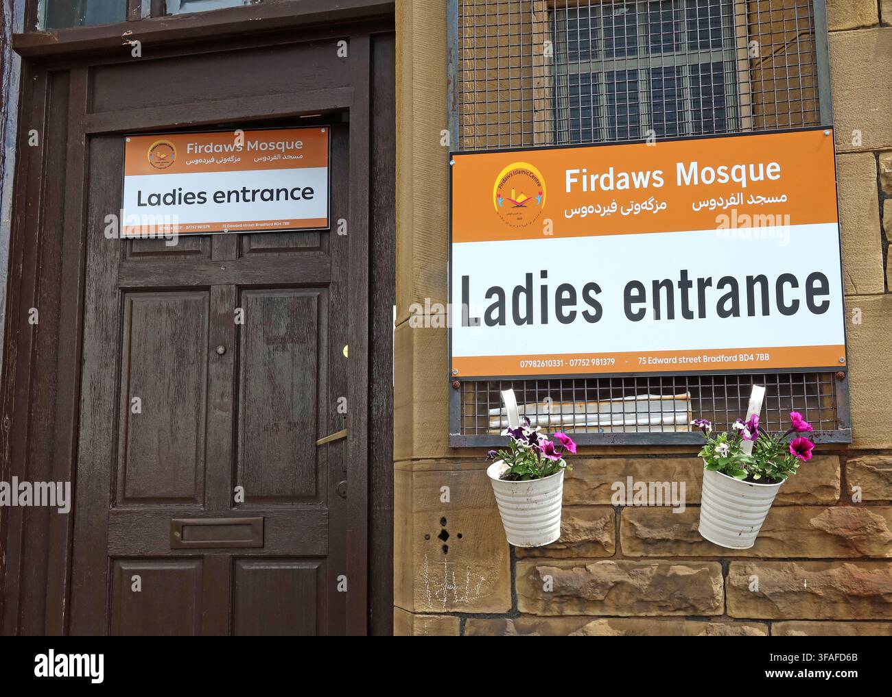 Ladies entrance sign at Firdaws Mosque in Bradford, West Yorkshire, showing a separate doorway and bilingual Islamic signage. Stock Photo