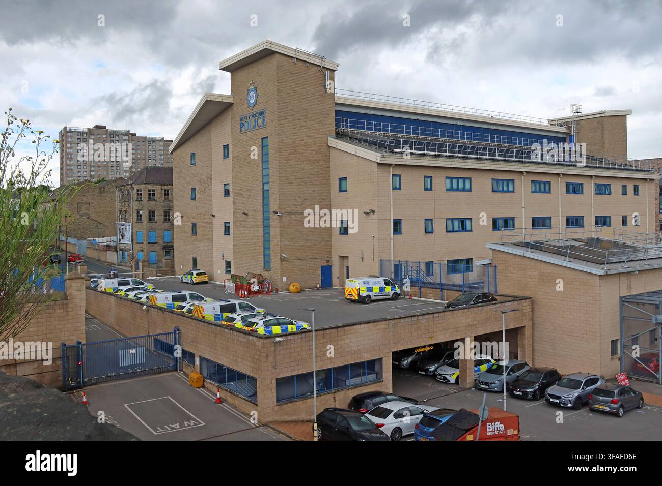 View of a major police building in Bradford city centre, West Yorkshire, beneath heavy grey skies. Stock Photo
