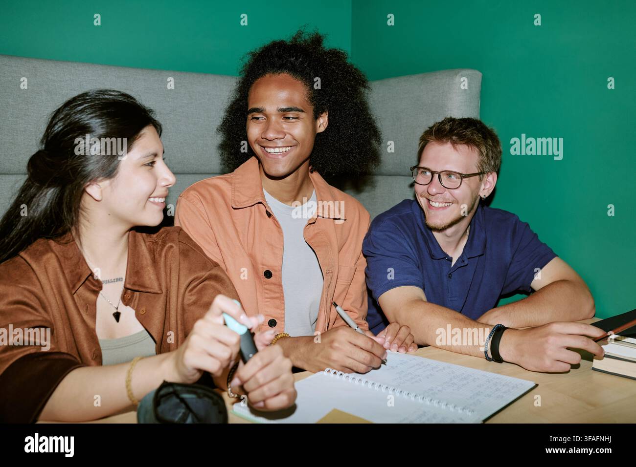 Diverse College Students Studying and Collaborating on Campus Stock Photo