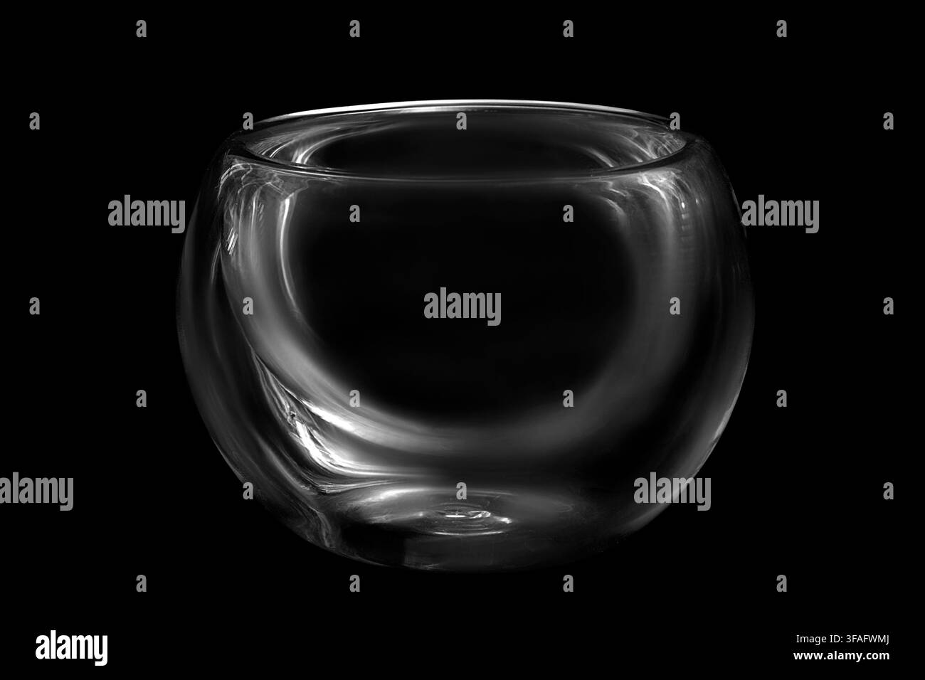Empty glass tea bowl isolated on black background Stock Photo