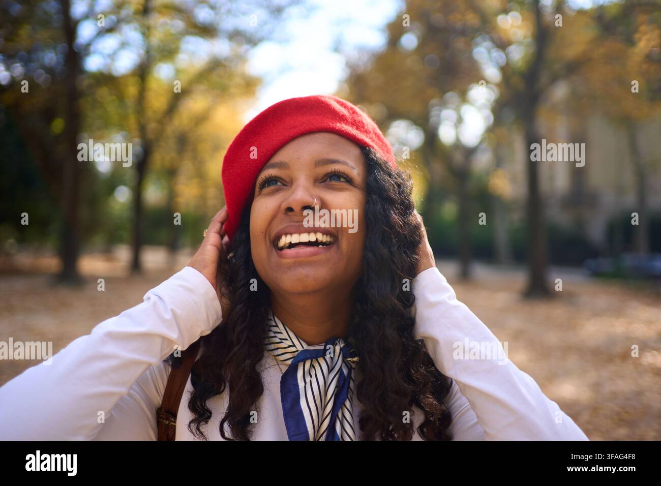 Woman smiling in an autumn forest. Stock Photo