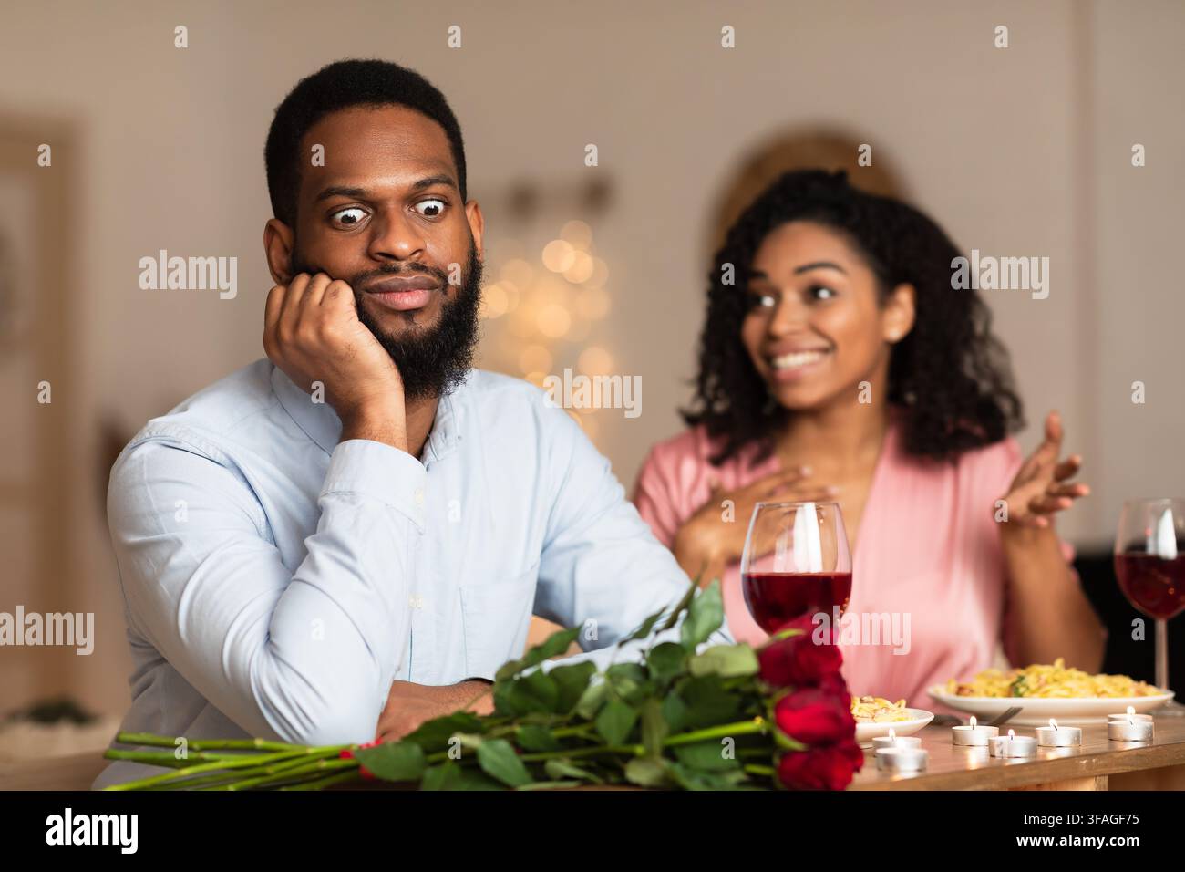 Black Man On Unsuccessful First Date In Restaurant Stock Photo