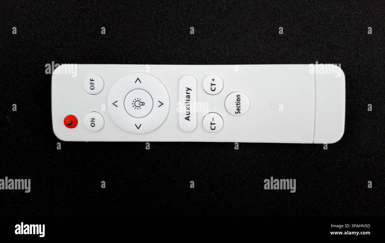 White LED Light Remote Control with Dimmable Lighting Buttons Stock Photo