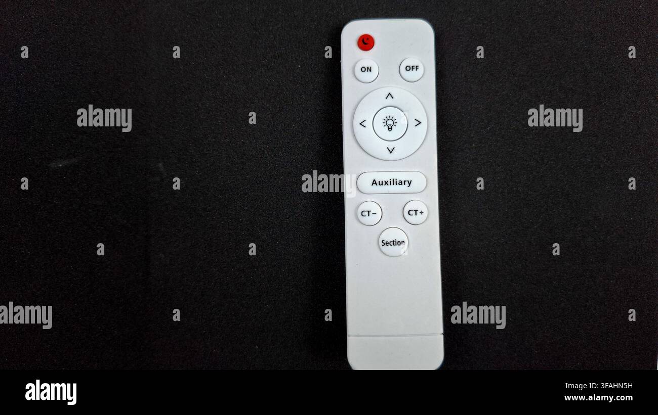 White LED Light Remote Control with Dimmable Lighting Buttons Stock Photo