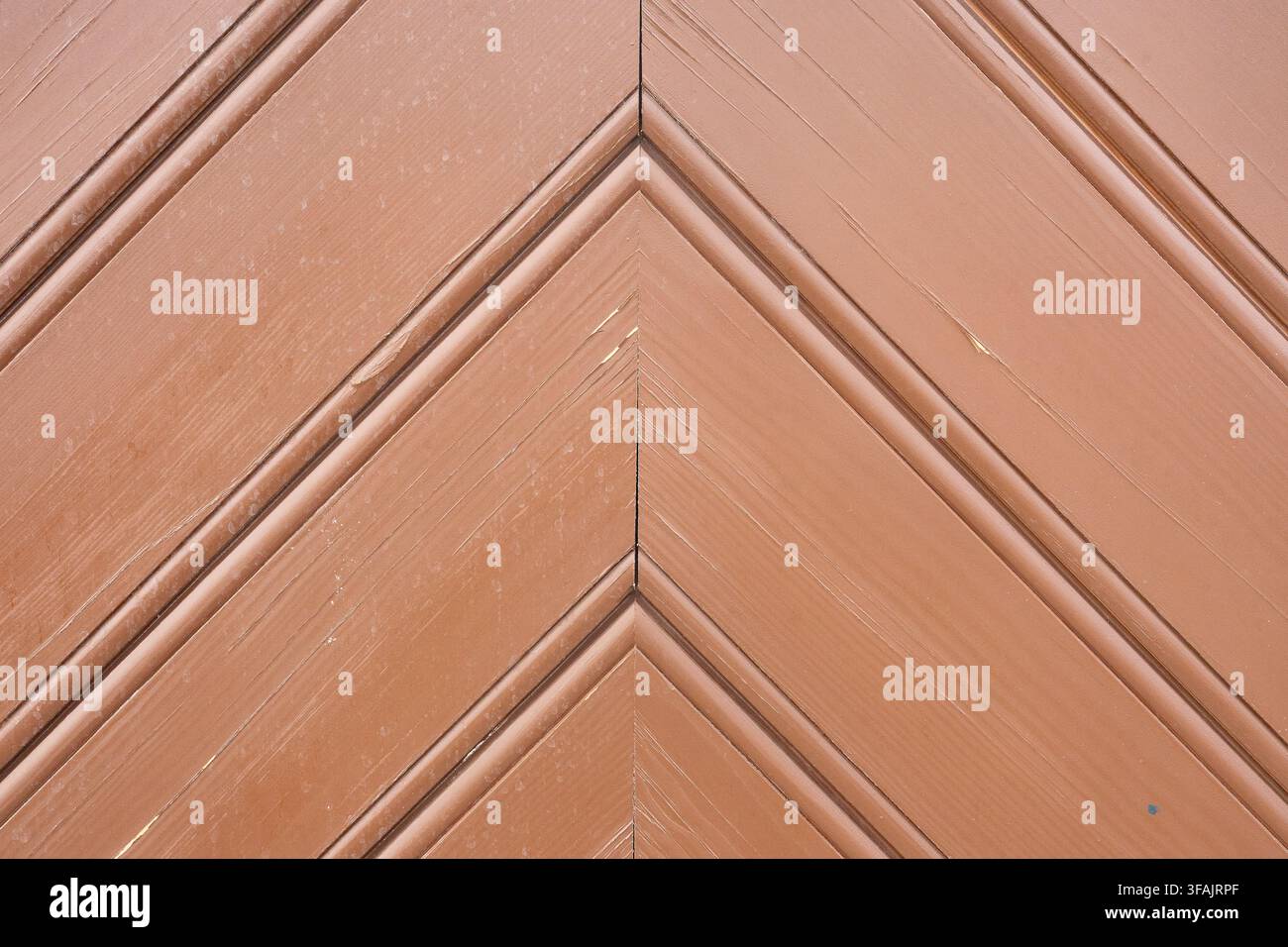 Brown wooden door chevron pattern texture background. Stock Photo