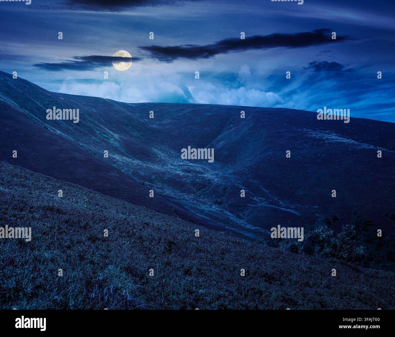 carpathian mountain landscape. travel ukraine in summer. slopes mountain ridge in august at night. wonderful carpathian adventure in full moon light Stock Photo