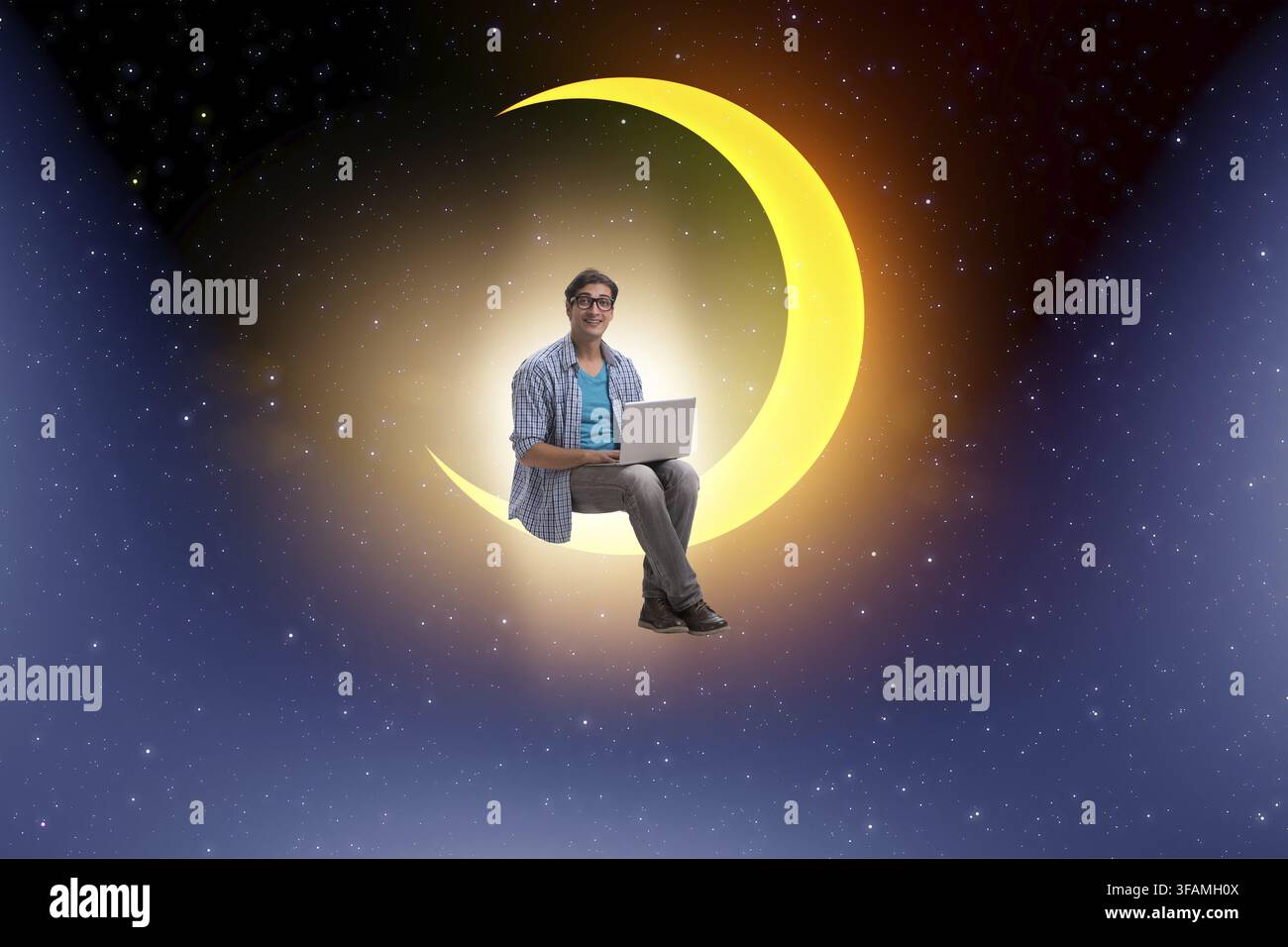 The student is working on a laptop on the crescent moon Stock Photo