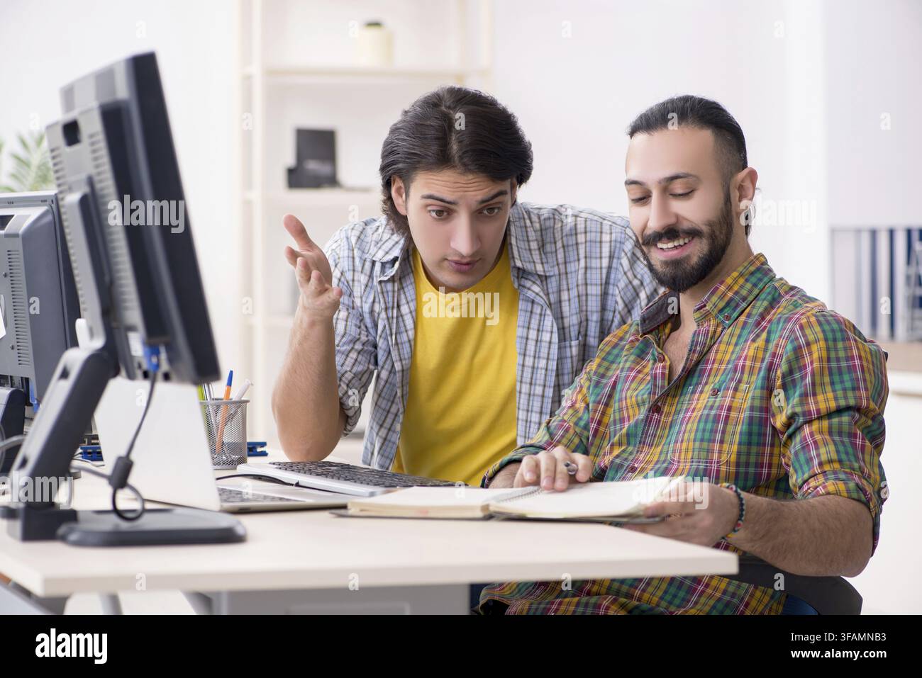 The two IT specialists who work in the office Stock Photo