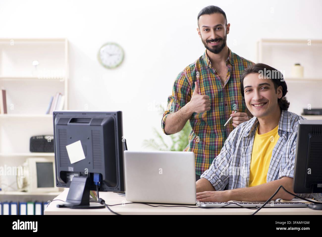 The two IT specialists who work in the office Stock Photo