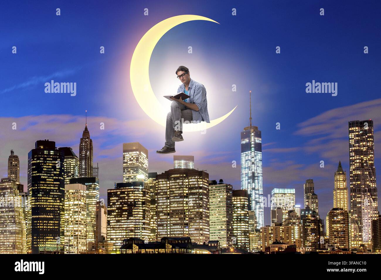 The student is reading a book on the crescent Stock Photo