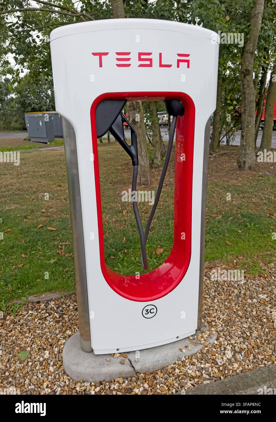 Tesla Supercharger at Gretna Green Services beside the A74(M) in Scotland, providing rapid electric vehicle charging on a major cross-border route. Stock Photo