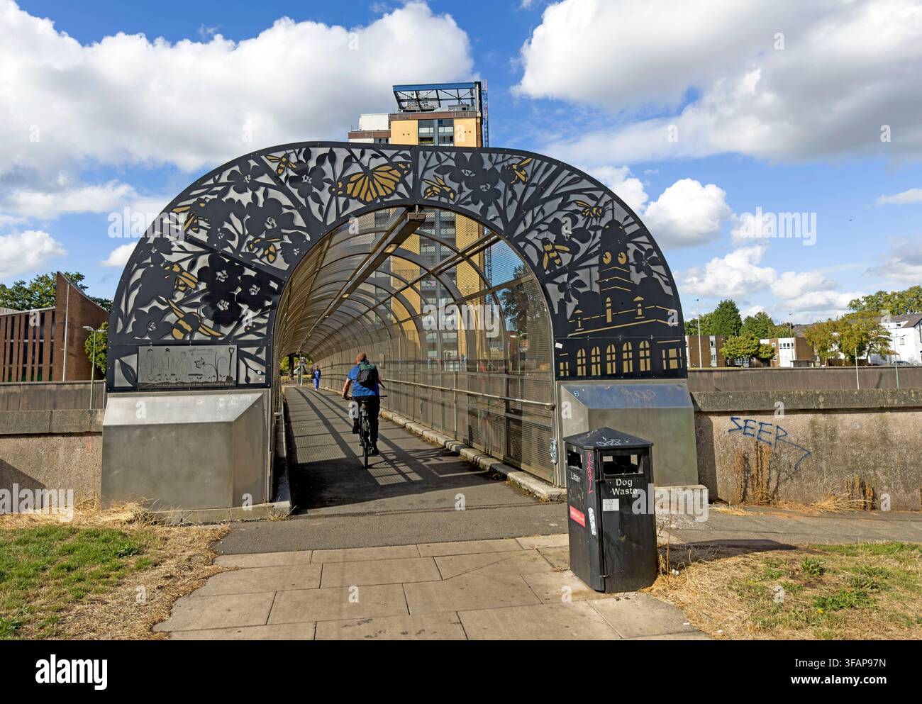 Clarendon Footbridge, a decorative pedestrian and cycle bridge crossing the M602 motorway at Eccles in Salford, Greater Manchester. Stock Photo
