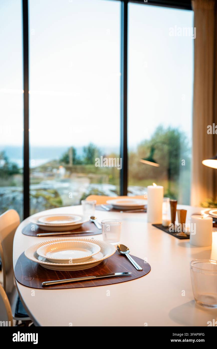 Elegant dinner table set with a scenic view Stock Photo