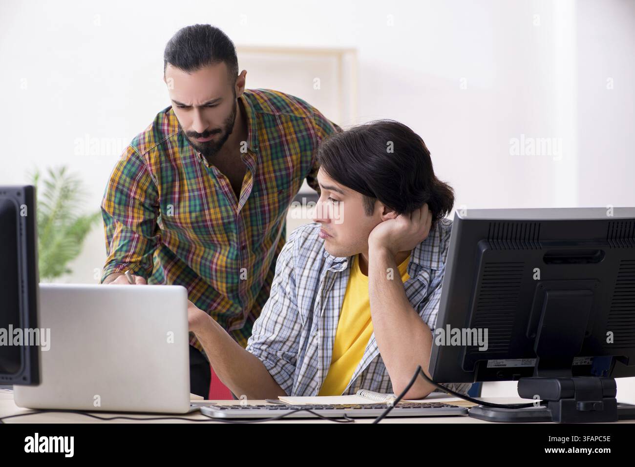 The two IT specialists who work in the office Stock Photo