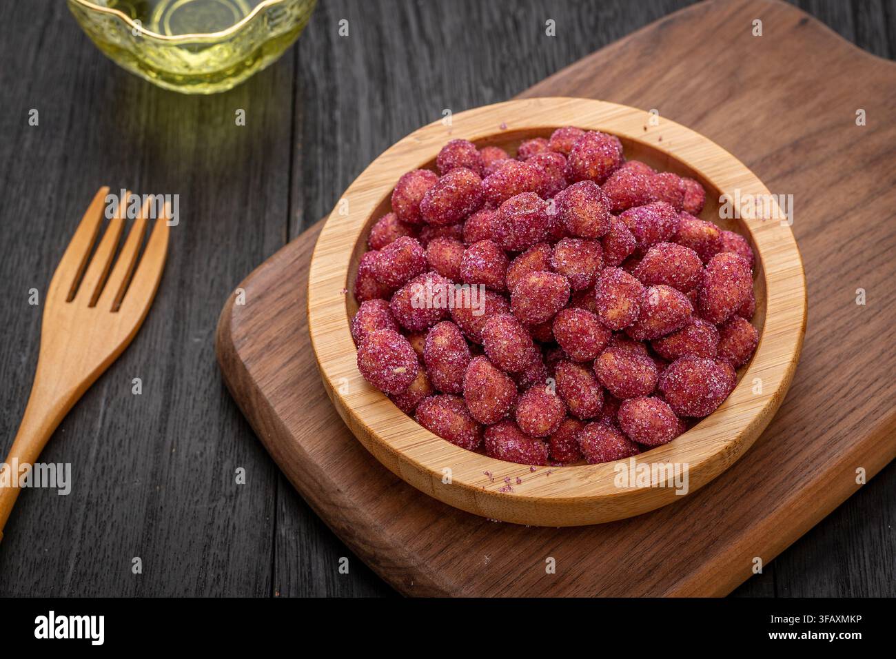 Purple coated crispy peanuts served in small plate Stock Photo