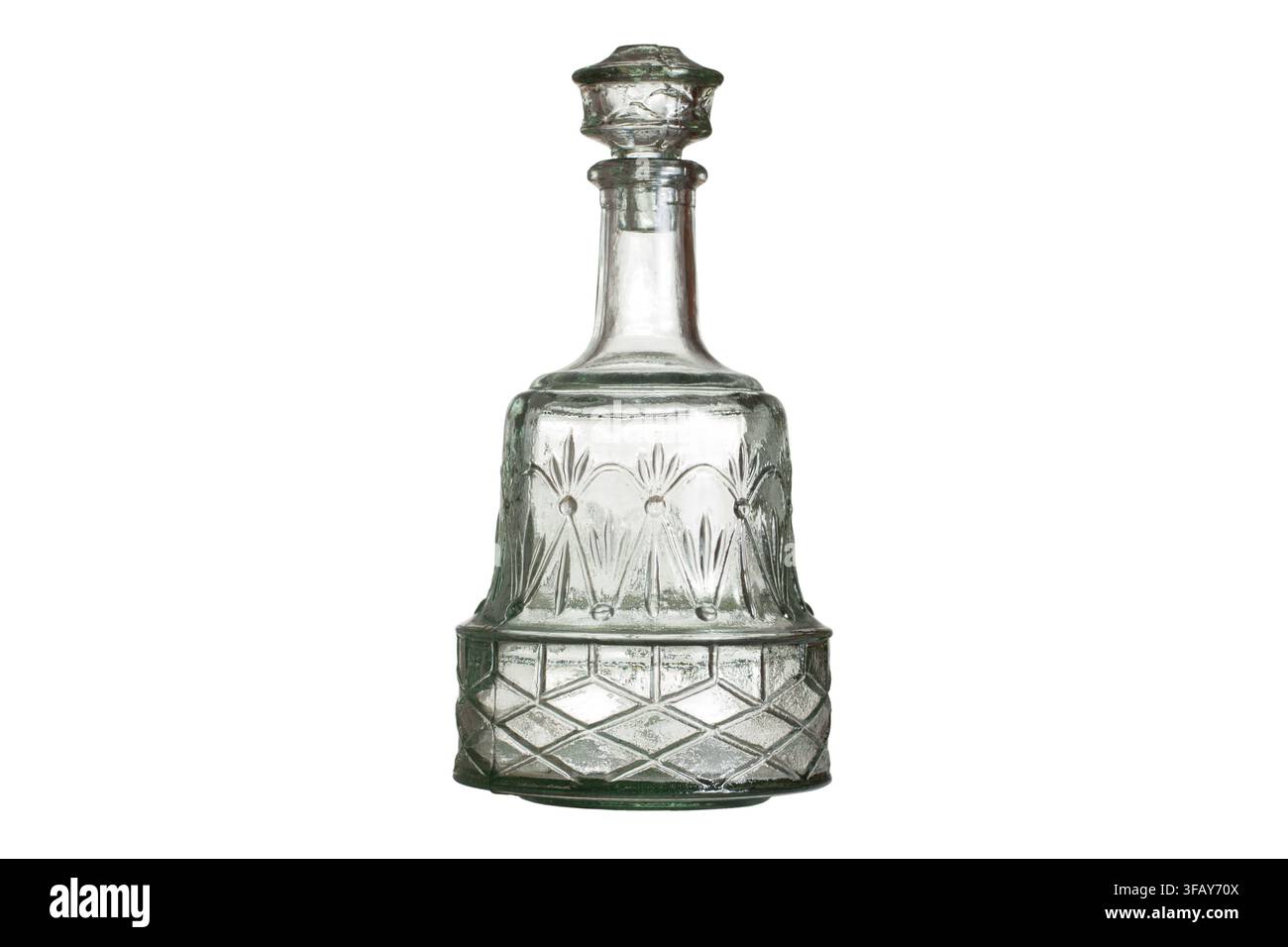 Glass decanter isolated on white background. Empty glass decanter with stopper. Stock Photo
