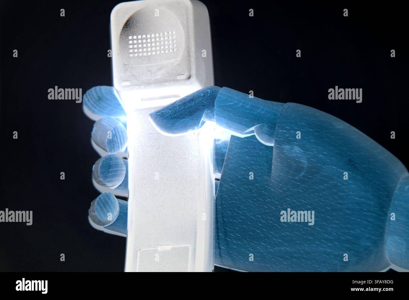 Robotic Hand Holding Wireless Phone for Future Communication Concept Stock Photo