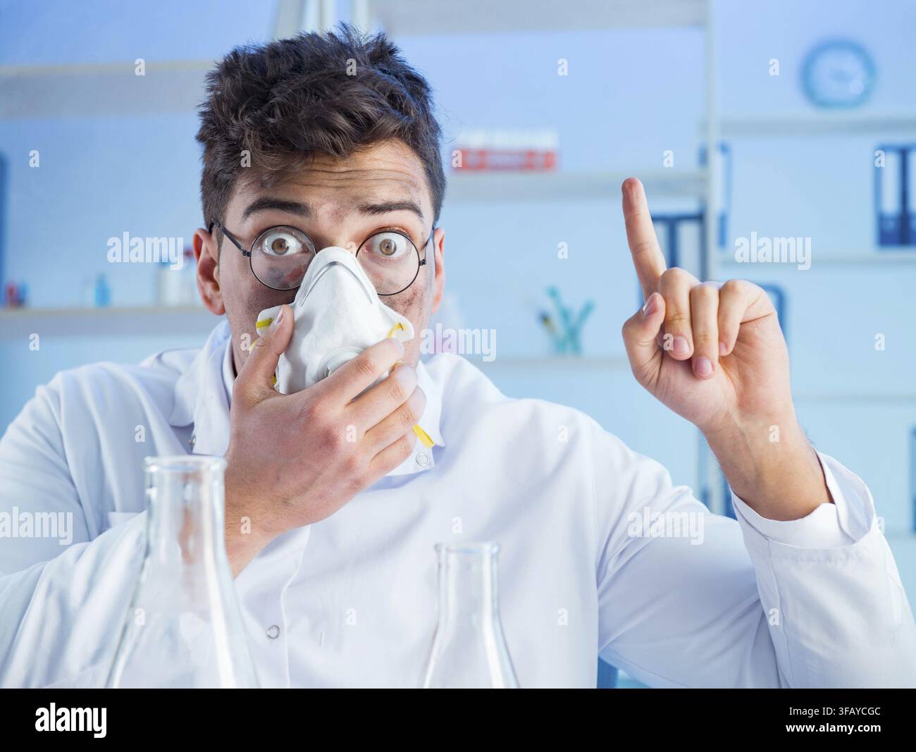 Funny crazy chemist working in a lab Stock Photo