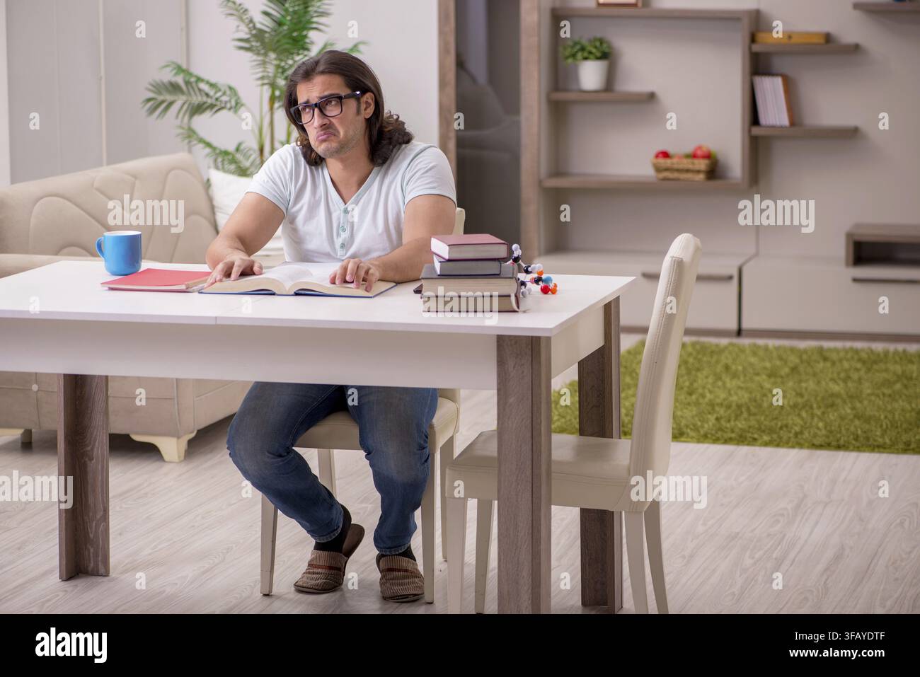 Young student preparing for exams at home Stock Photo