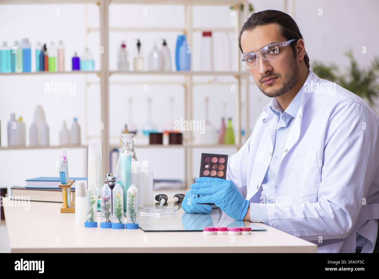 Young chemist working in laboratory Stock Photo