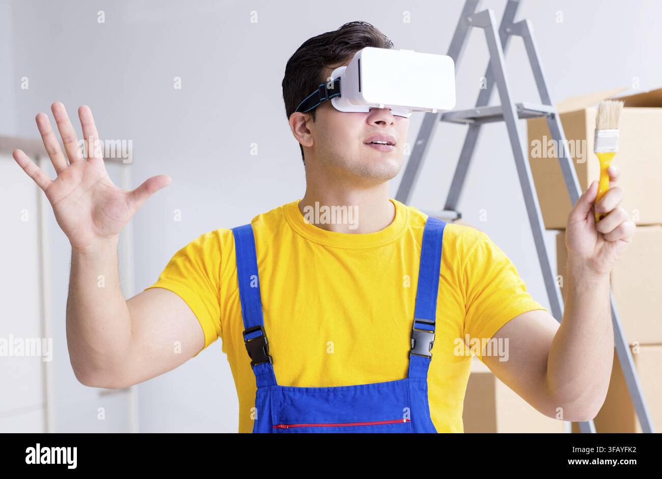 Painter, contractor working with virtual reality glasses Stock Photo