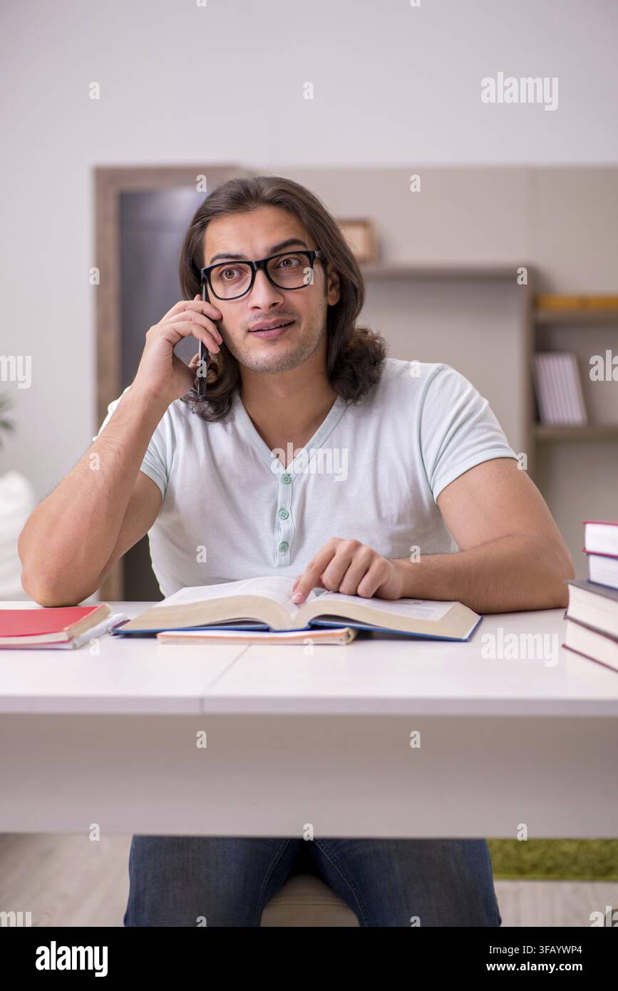 Young student preparing for exams at home Stock Photo