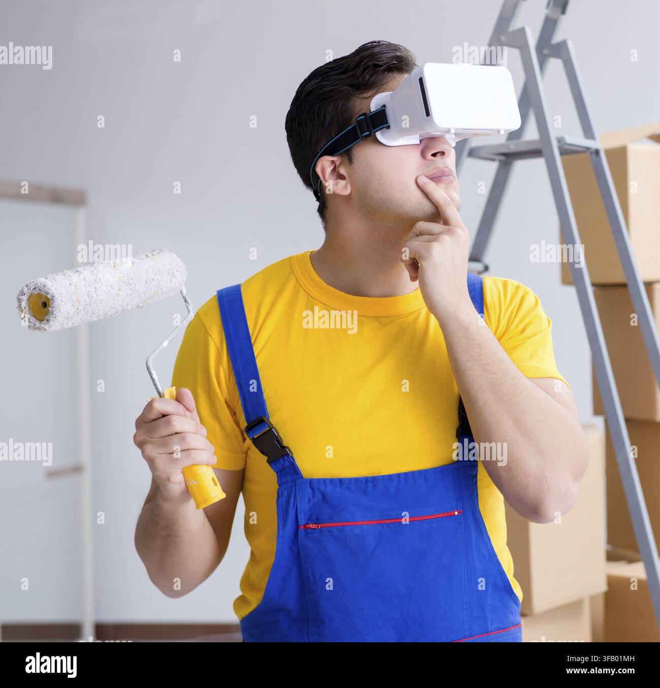 Painter, contractor working with virtual reality glasses Stock Photo