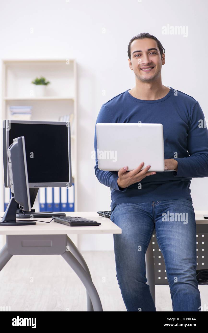 Young IT specialist working in an office Stock Photo