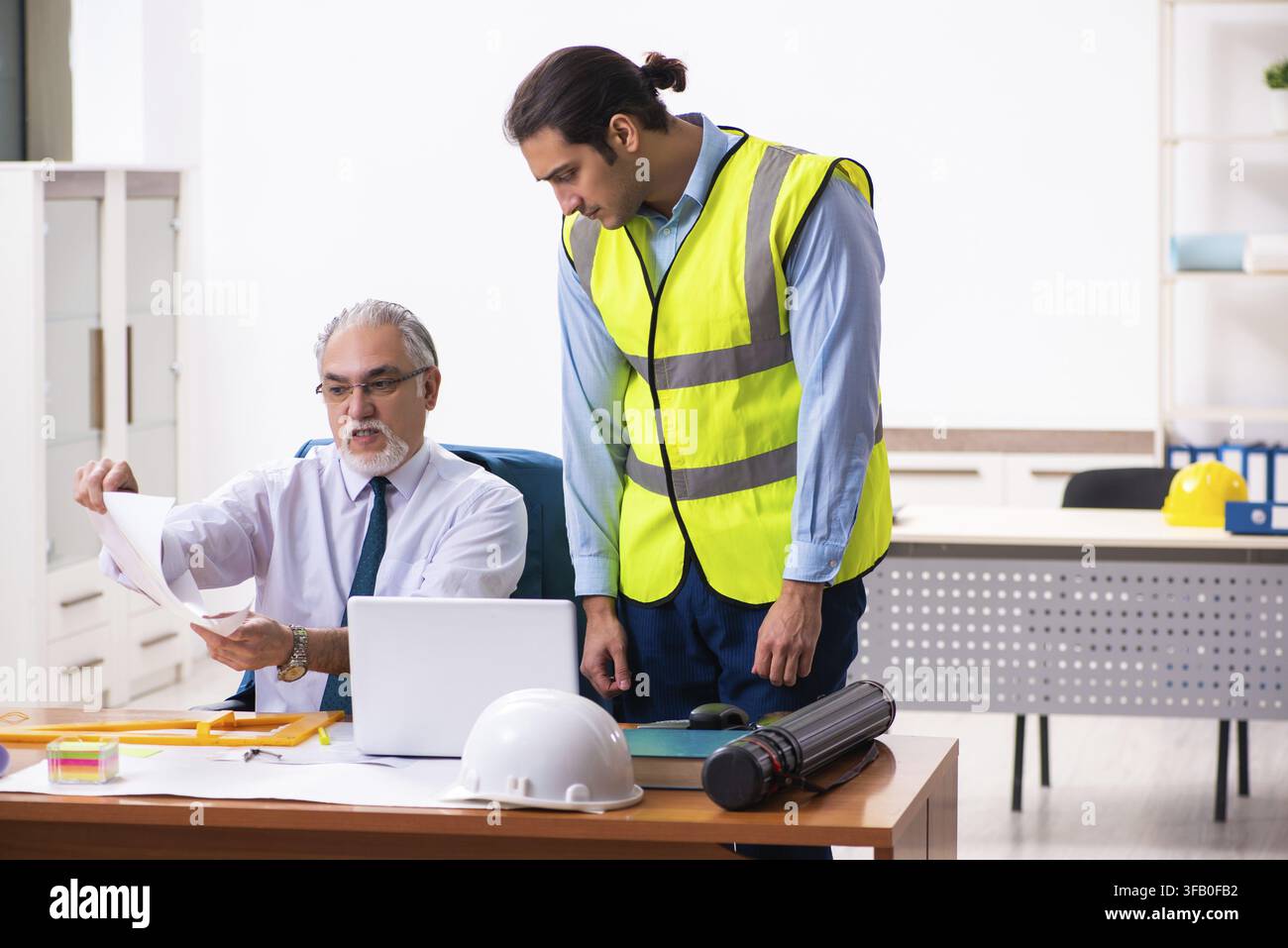 Two architects working in an office Stock Photo