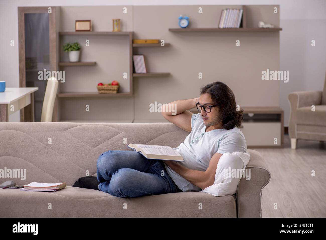 Young student preparing for exams at home Stock Photo