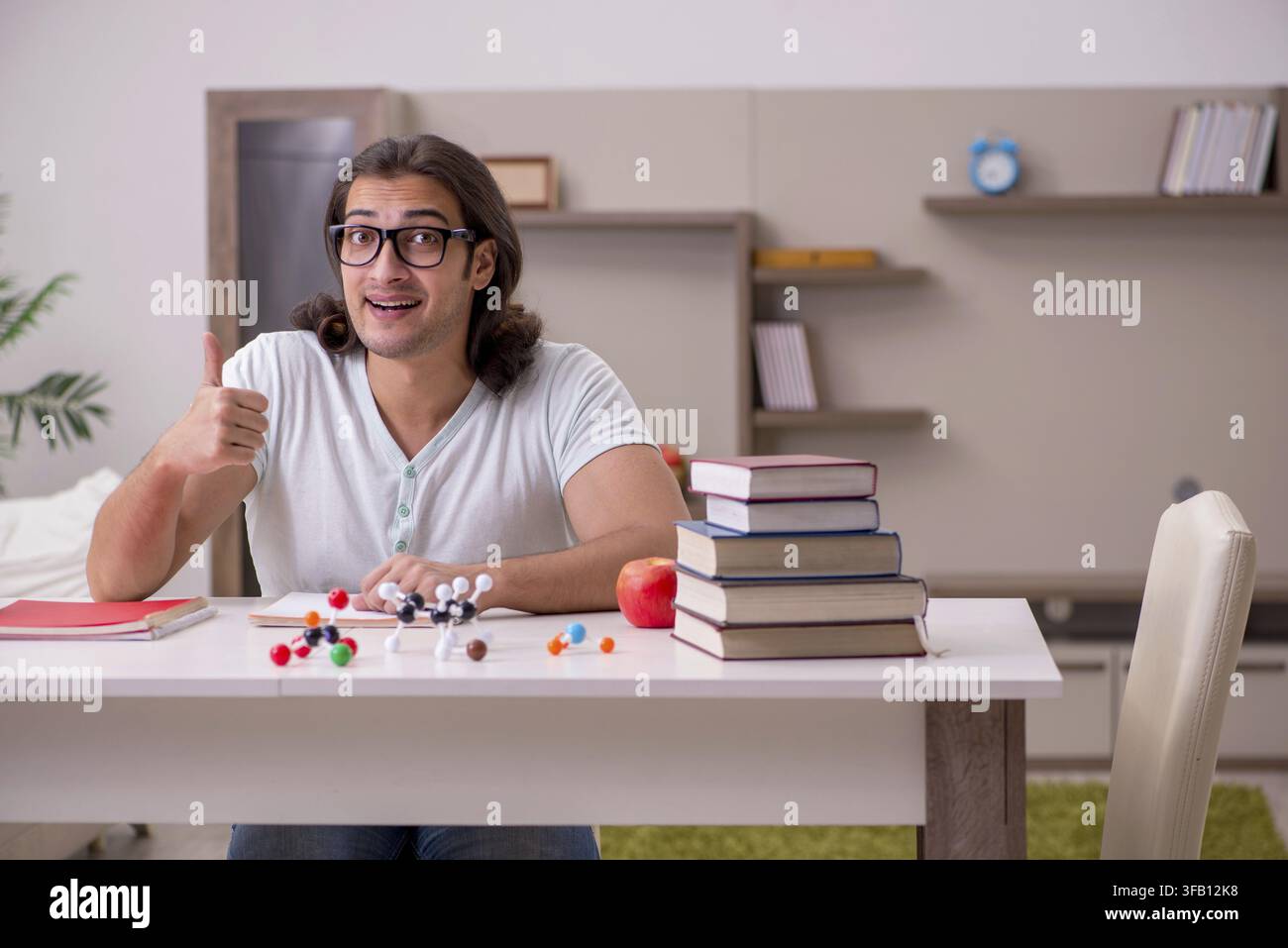 Young student preparing for exams at home Stock Photo