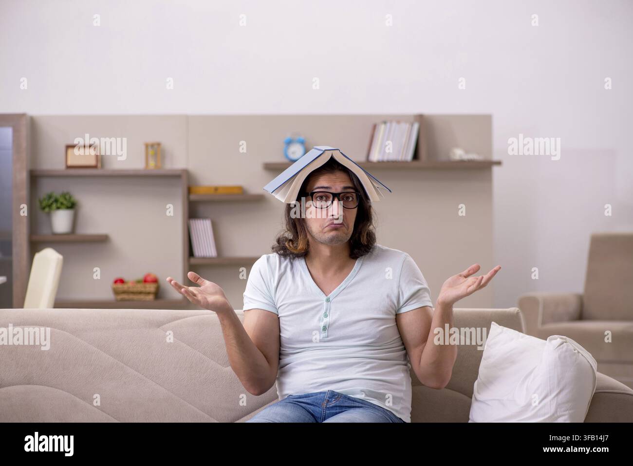 Young student preparing for exams at home Stock Photo