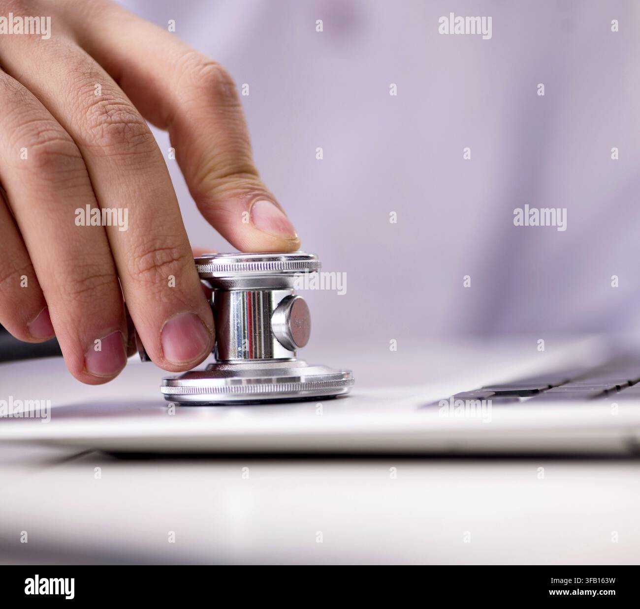The IT technician repairs a broken laptop notebook Stock Photo