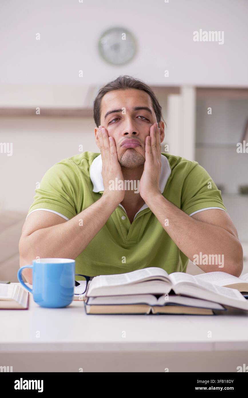 Young student preparing for exams at home Stock Photo