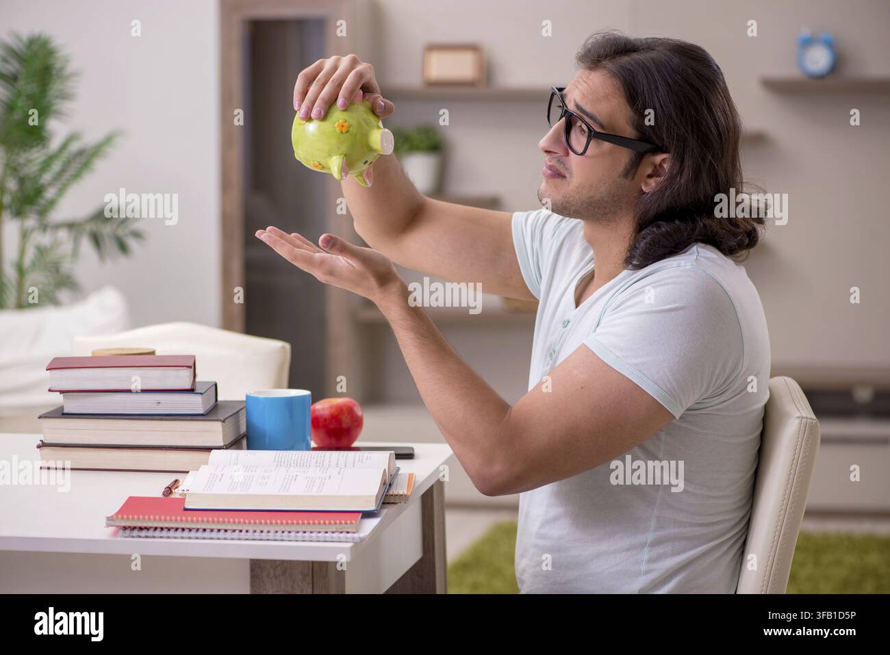 Young student preparing for exams at home Stock Photo