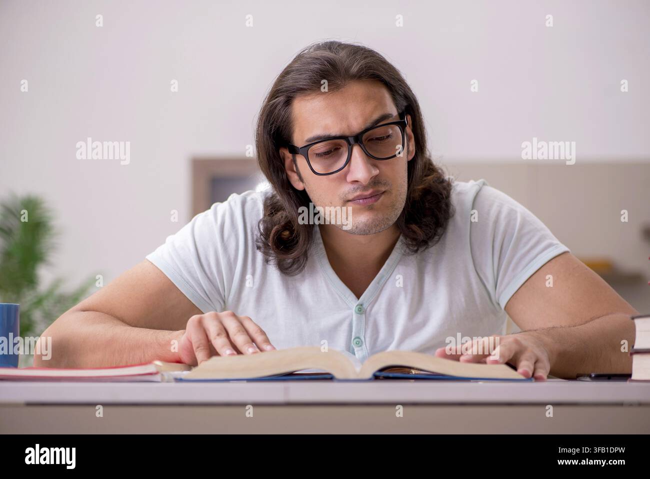 Young student preparing for exams at home Stock Photo