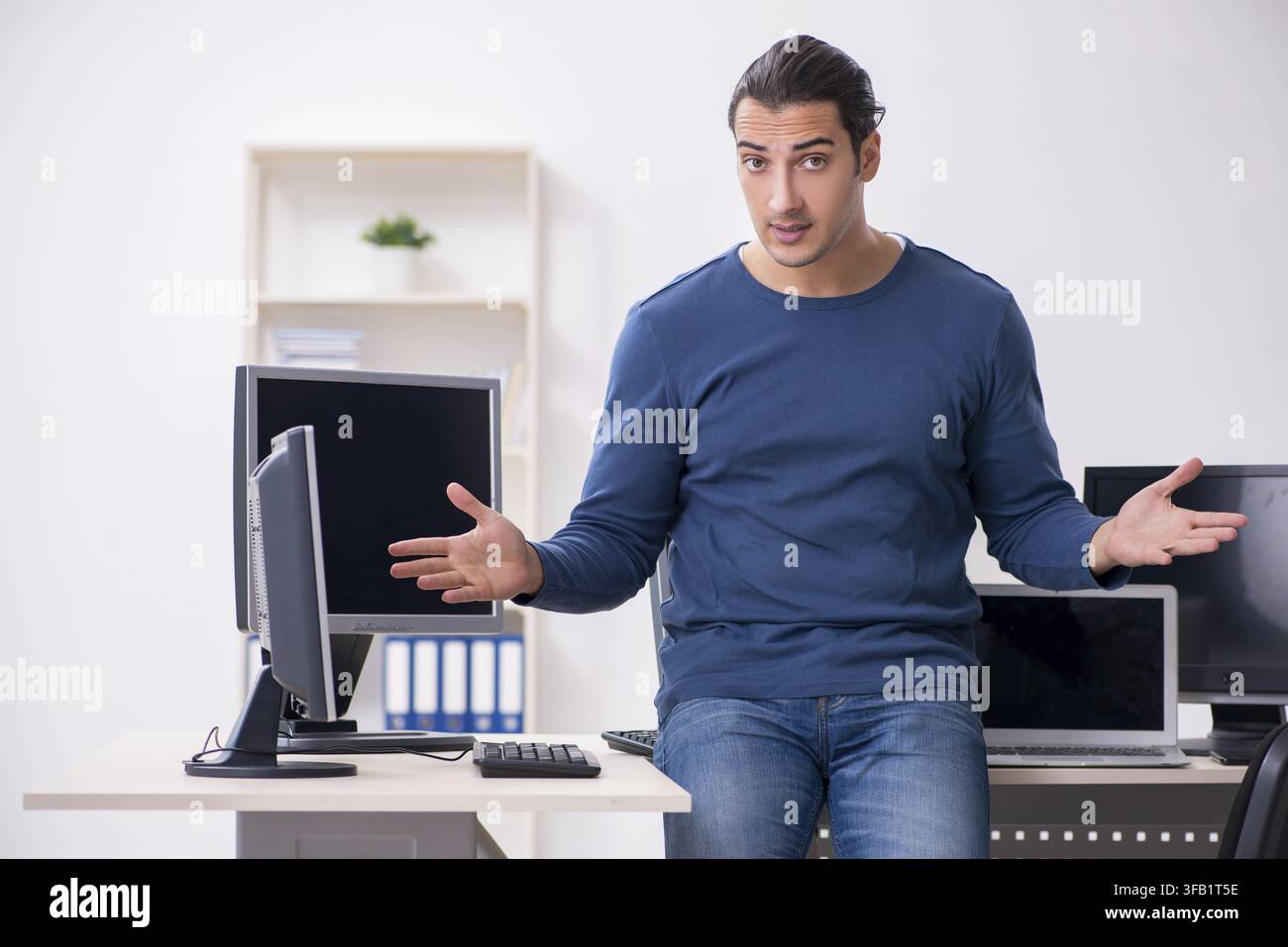 Young IT specialist working in an office Stock Photo