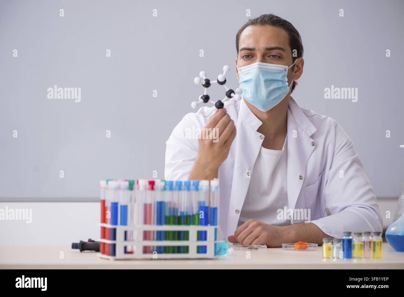 Young chemist working in laboratory Stock Photo