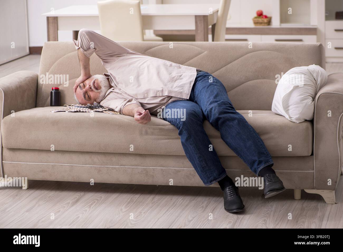 Old man is suffering at home Stock Photo