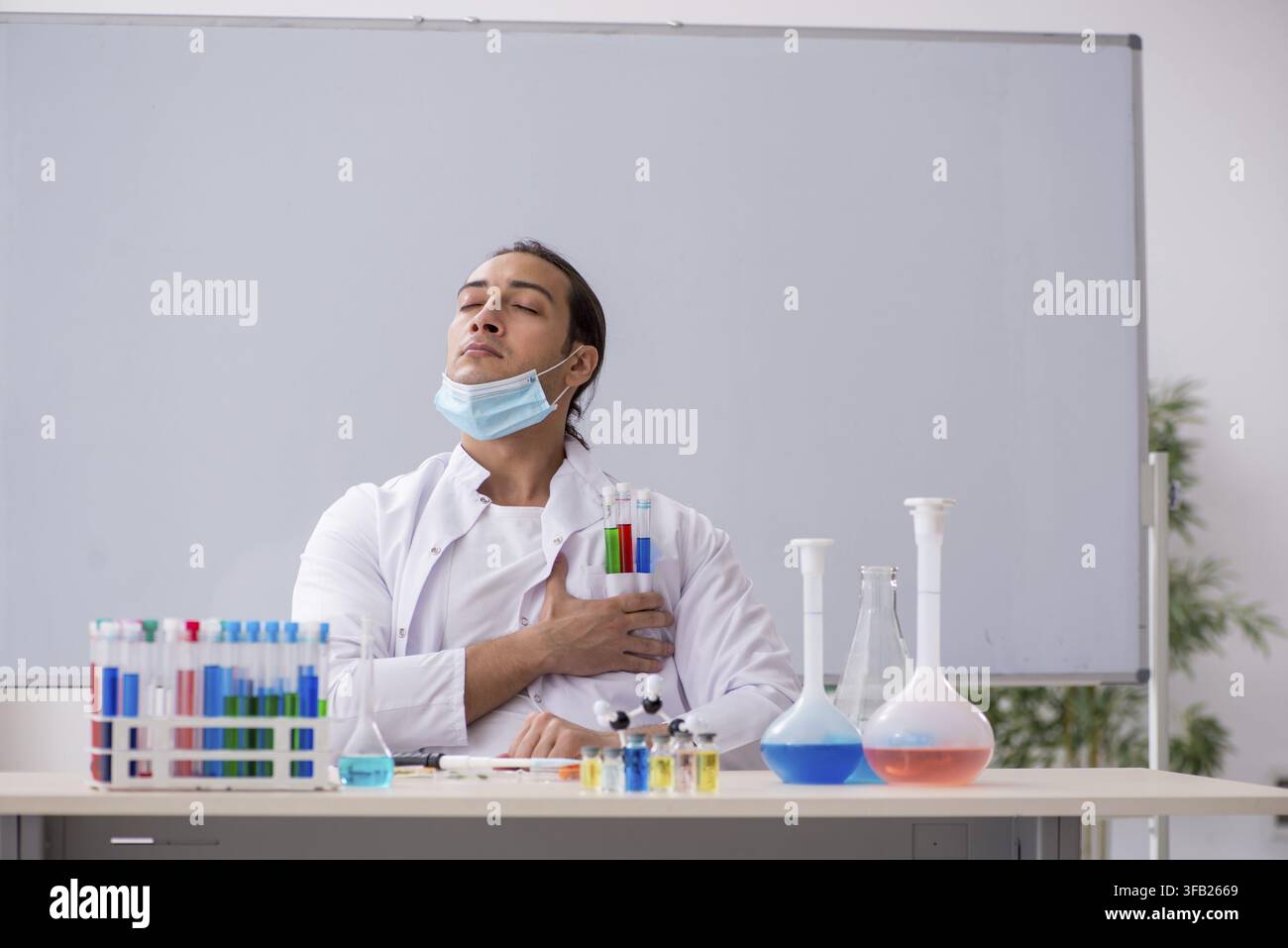 Young chemist working in laboratory Stock Photo