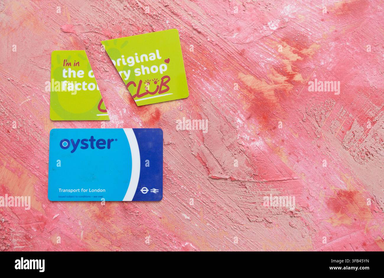 A Factory Shop loyalty card redundant since the retail outlet went into administration and an Oyster card essential for travelling about in London Stock Photo