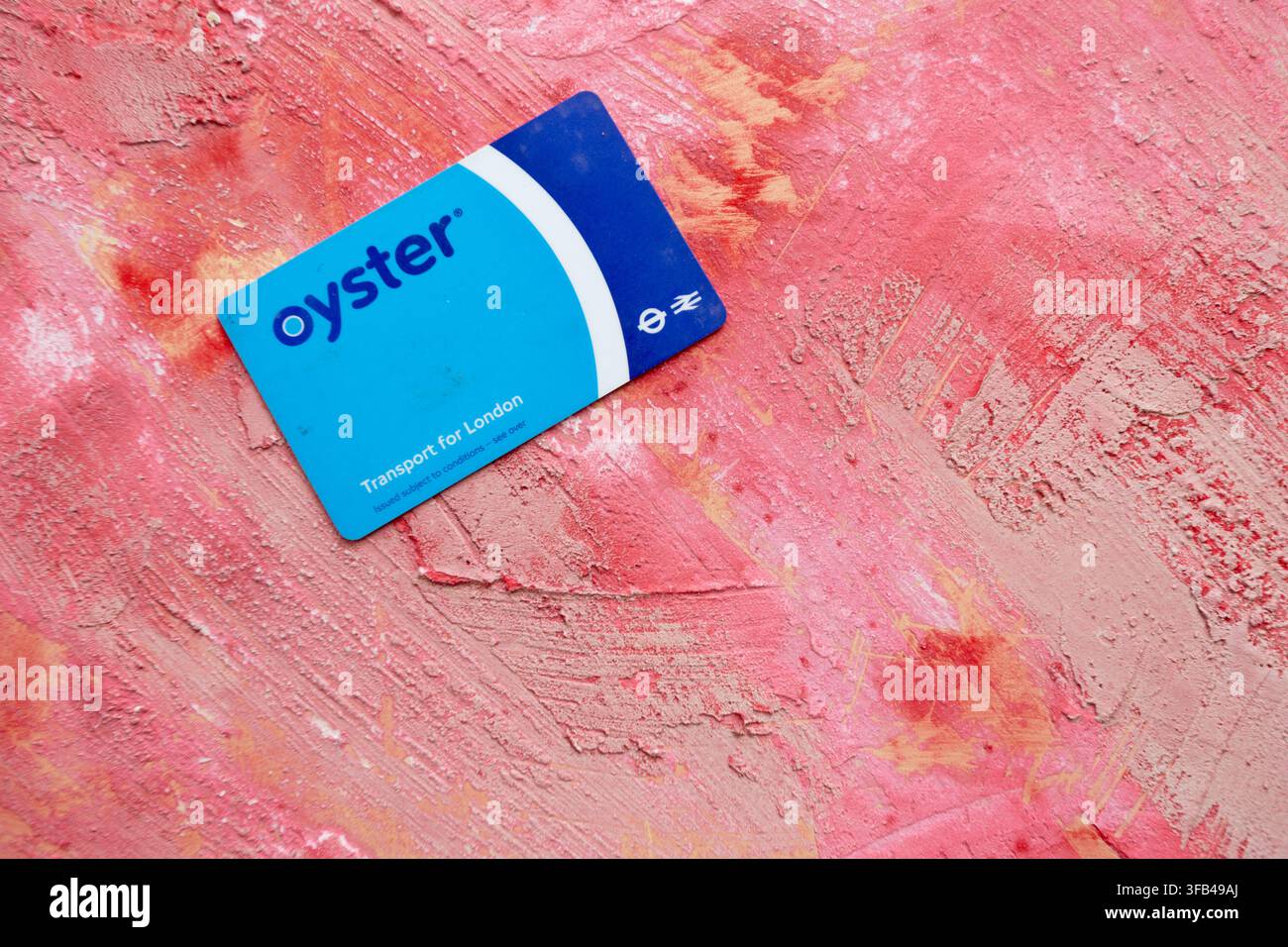 A Transport for London prepaid contactless Oyster card is essential for getting about in the UK's capital especially as the buses don't accept cash. Stock Photo