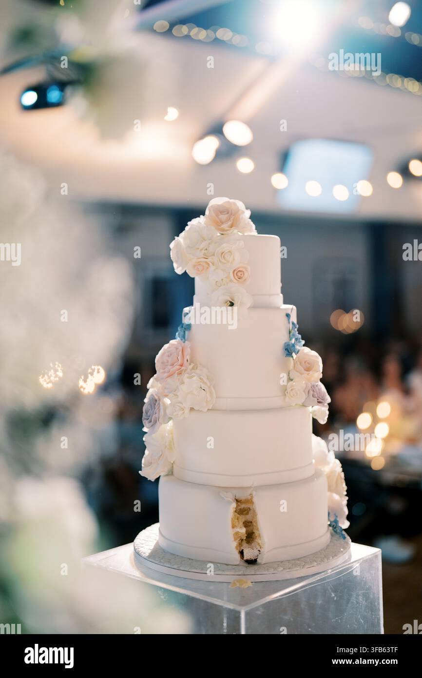 Elegant Four Tier Wedding Cake with Floral Decorations in Toronto Venue Stock Photo