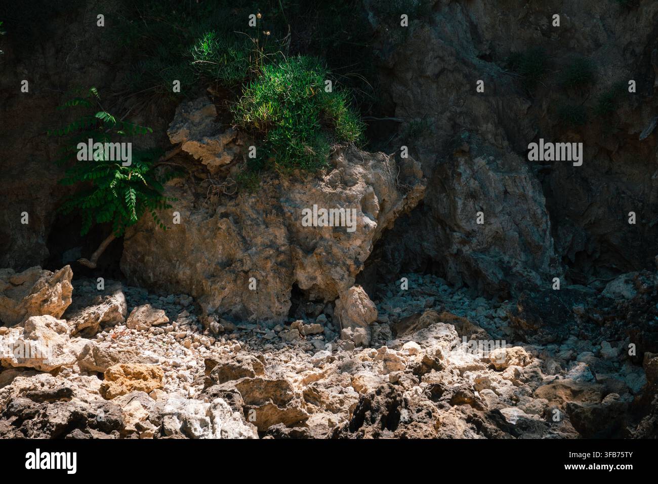 Rugged sunlit limestone cliff hi-res stock photography and images - Alamy