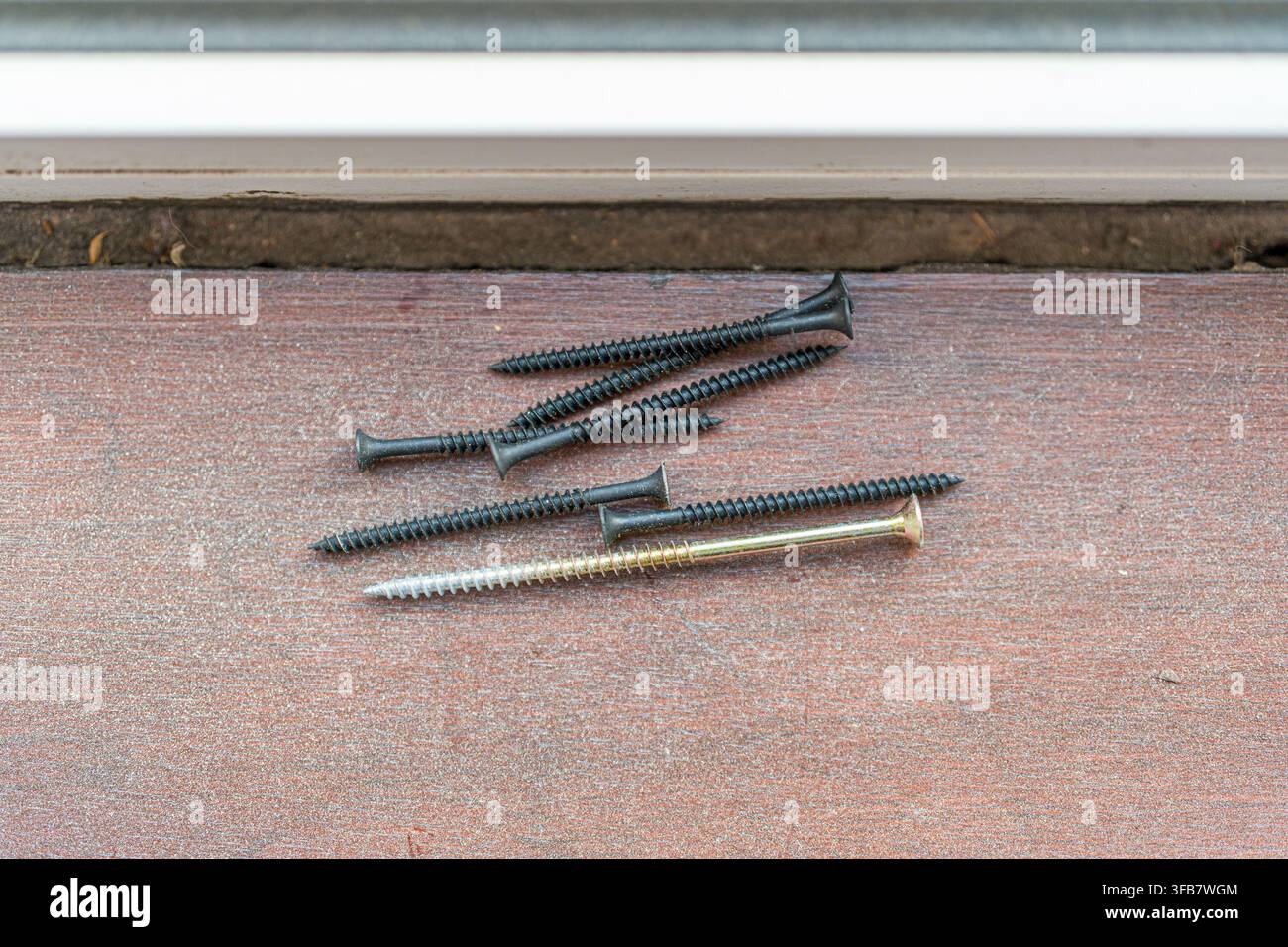 Assorted carpentry tools on wooden floor during renovation Stock Photo