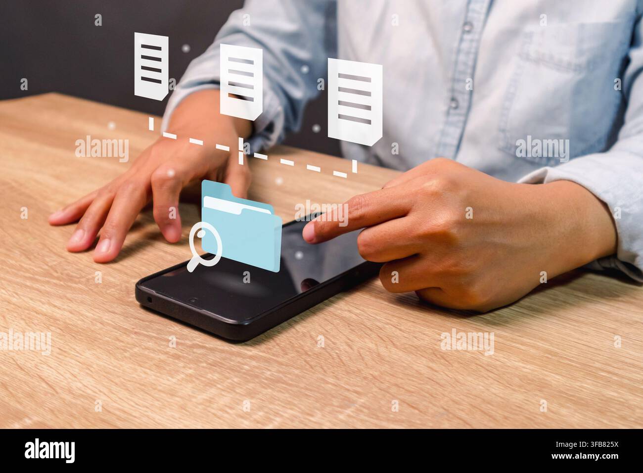 A woman searching for files or folders on his smartphone Stock Photo