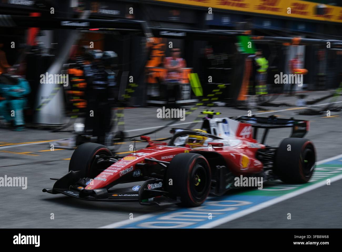 Ferrari driver Lewis Hamilton of Britain makes a pit stop during the ...