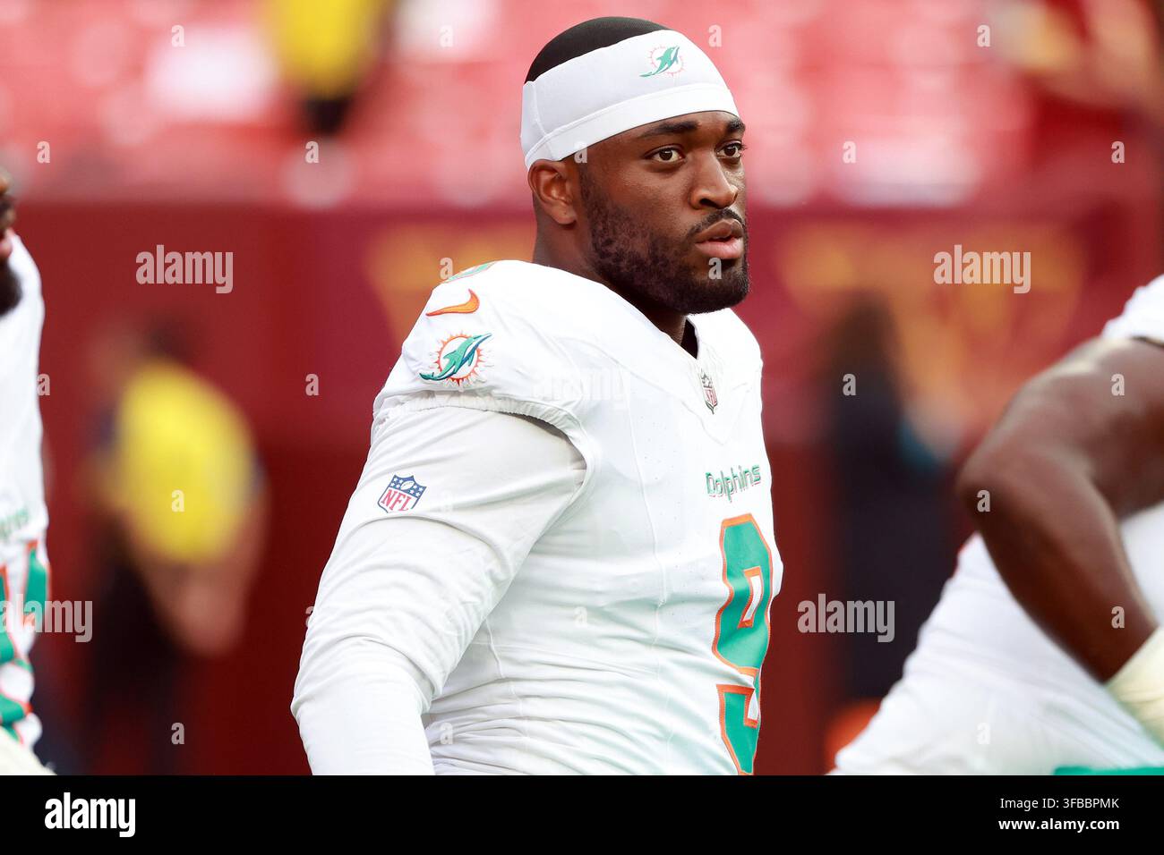 Miami Dolphins linebacker Josh Uche (9) looks on before an NFL football ...